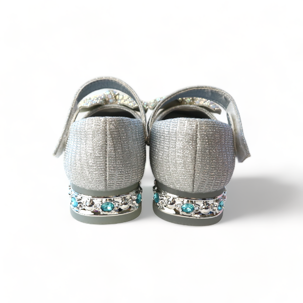Back view of girls silver glitter dress shoes showing rhinestone and turquoise jewel embellished heel