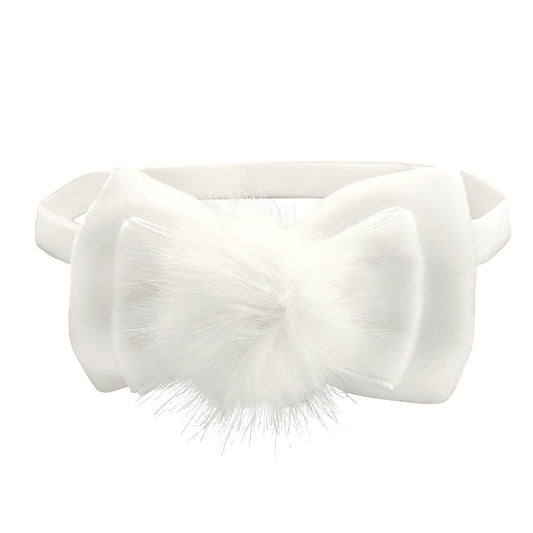 Baby girl white bow headband with fluffy pom-pom center on white background - soft elastic infant headband