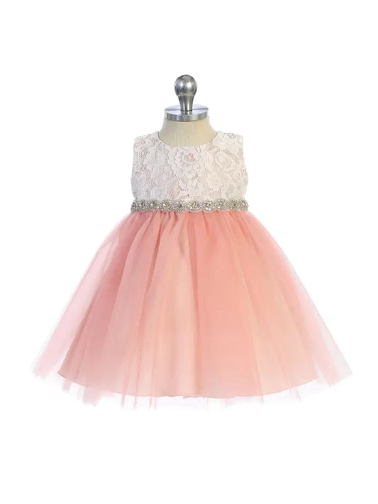 Baby girl wearing blush pink lace tulle dress with rhinestone waist and full skirt - front view