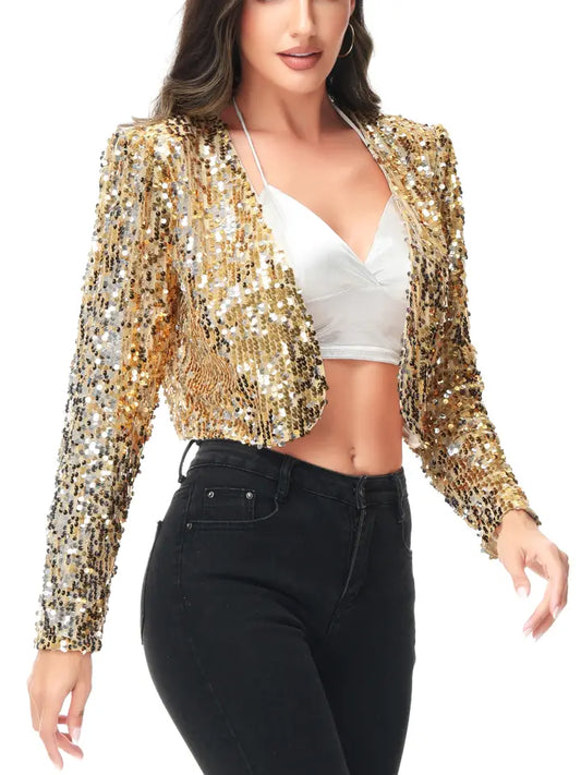 Woman wearing a gold sequin jacket over a white top and black pants on a white background