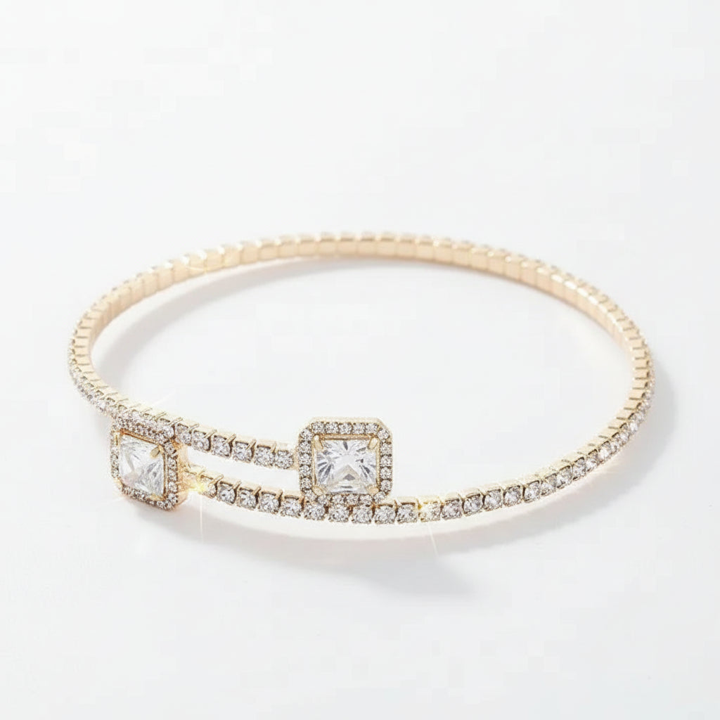 Gold rhinestone cuff bracelet showing adjustable open-back design with square crystal details