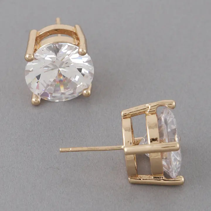 Large gold cubic zirconia stud earrings showing front and side view with prong setting detail
