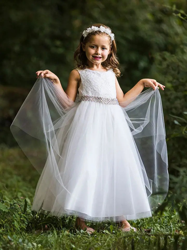 Full-length view of girls' white lace formal dress showing tea-length silhouette and elegant design
