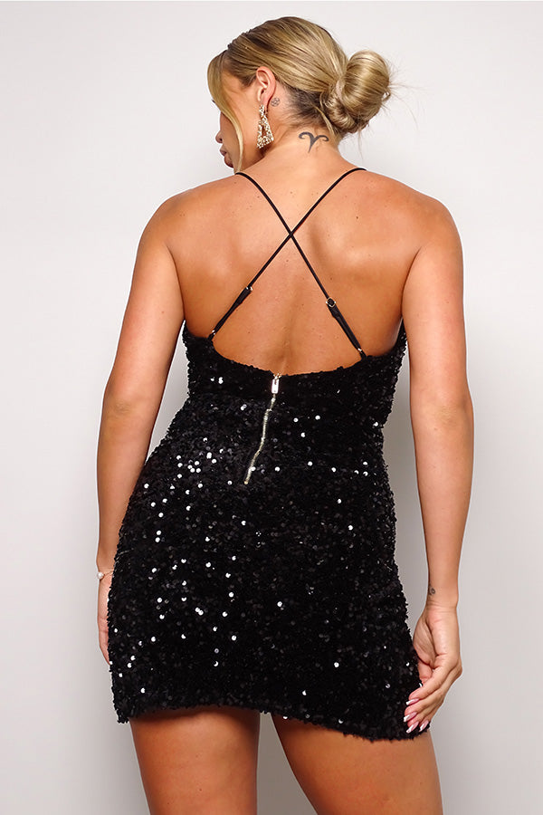 Black sequin velvet mini dress with criss cross back view showing adjustable straps and draped detail
