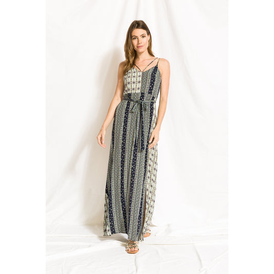 This image features a stylish mix print maxi dress, ideal for a blend of casual and fashionable looks. The dress showcases a variety of prints, including geometric patterns and possibly floral elements, in a blend of neutral and slightly vibrant hues.