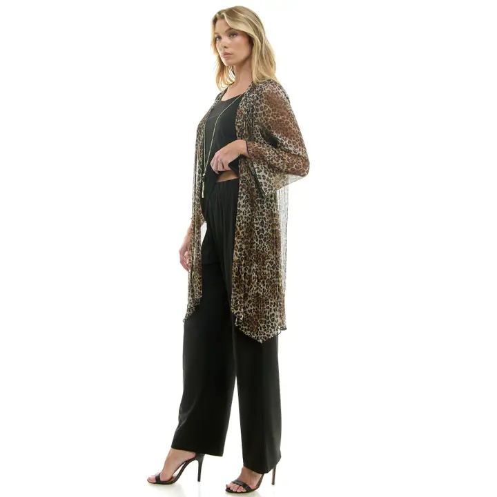 Side angle view of woman in leopard print chiffon duster cardigan over black outfit with pendant necklace