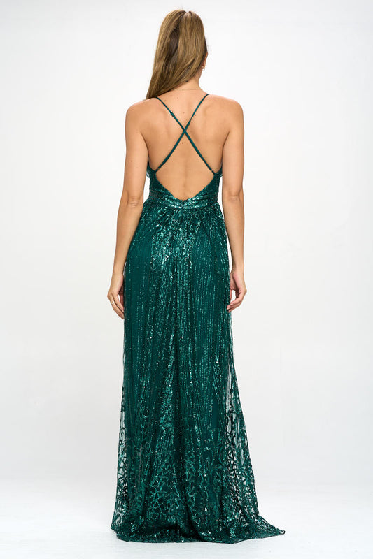 Back view of emerald green sequin gown with X-strap back design and full-length hem