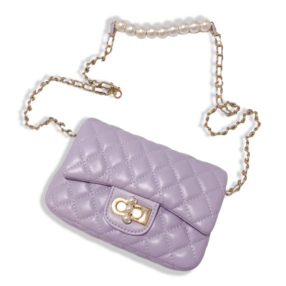 Lavender quilted girls purse with pearl closure charm and gold chain strap on white background