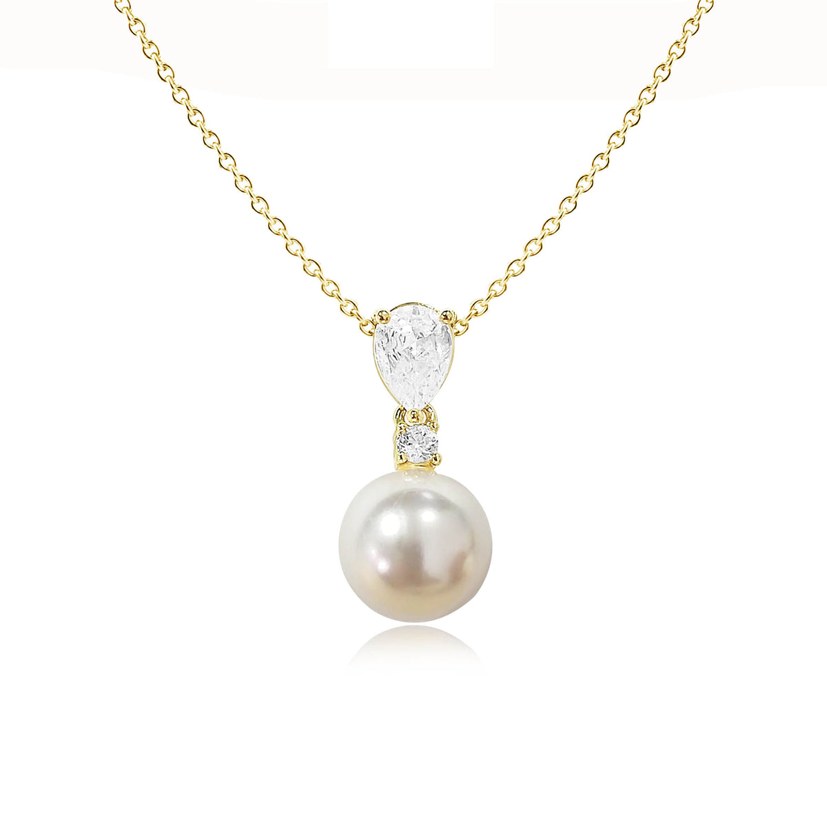 Pearl pendant necklace with cubic zirconia accents on gold chain against white background