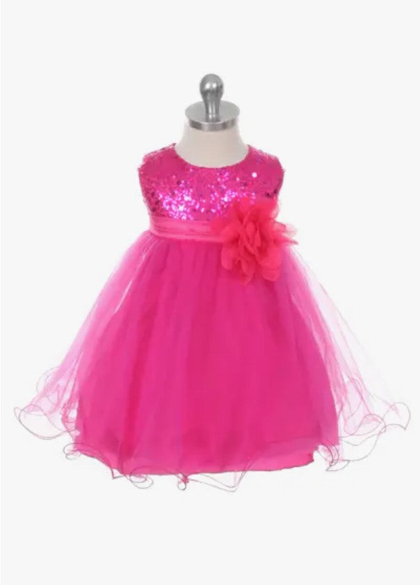 aby sequin party dress in hot pink with sparkly bodice and organza overlay on dress form