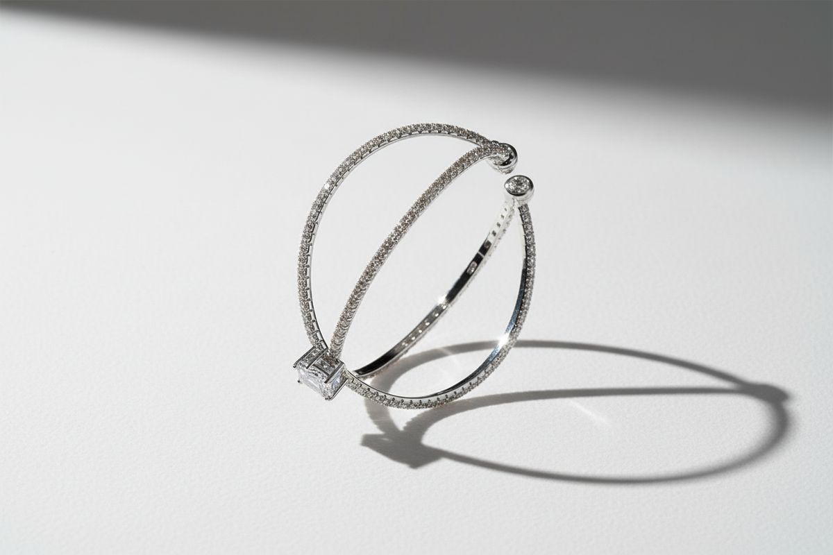 Cubic zirconia crossover cuff bracelet in silver finish shown from side angle