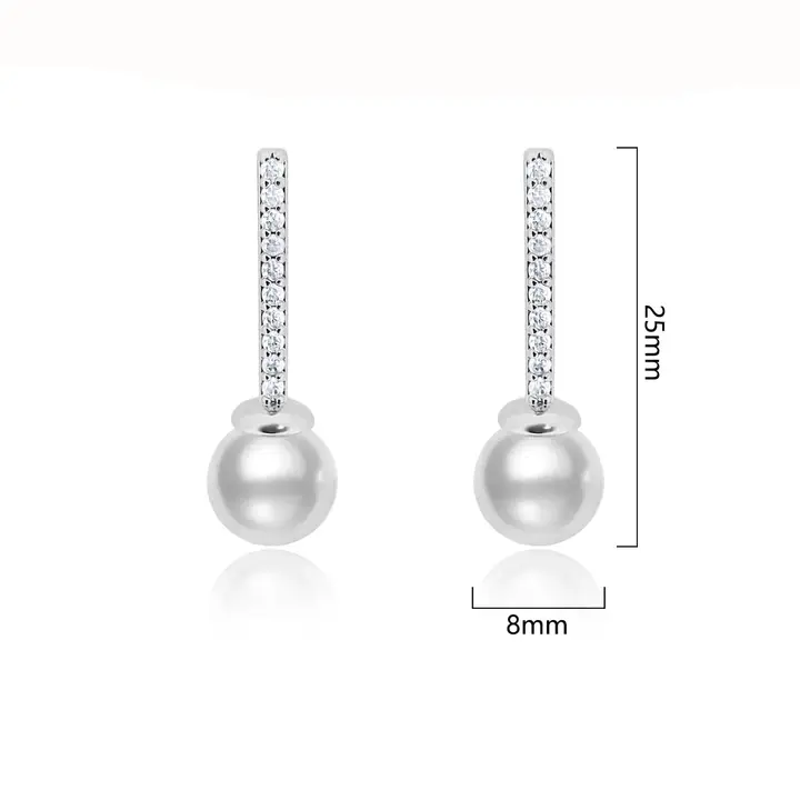 Pearl drop earrings with cubic zirconia pavé bar in silver finish, shown with dimension measurements of 8mm width and 25mm total length