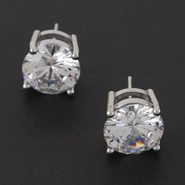 Large silver cubic zirconia stud earrings showing brilliant round-cut stones with faceted detail