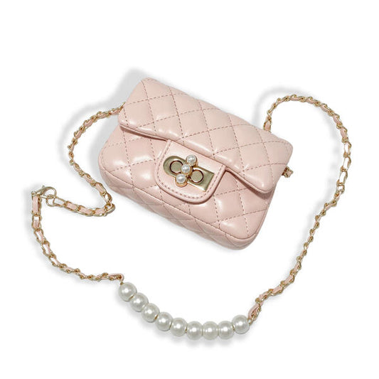 Blush pink quilted girls purse with pearl closure charm and gold chain strap on white background