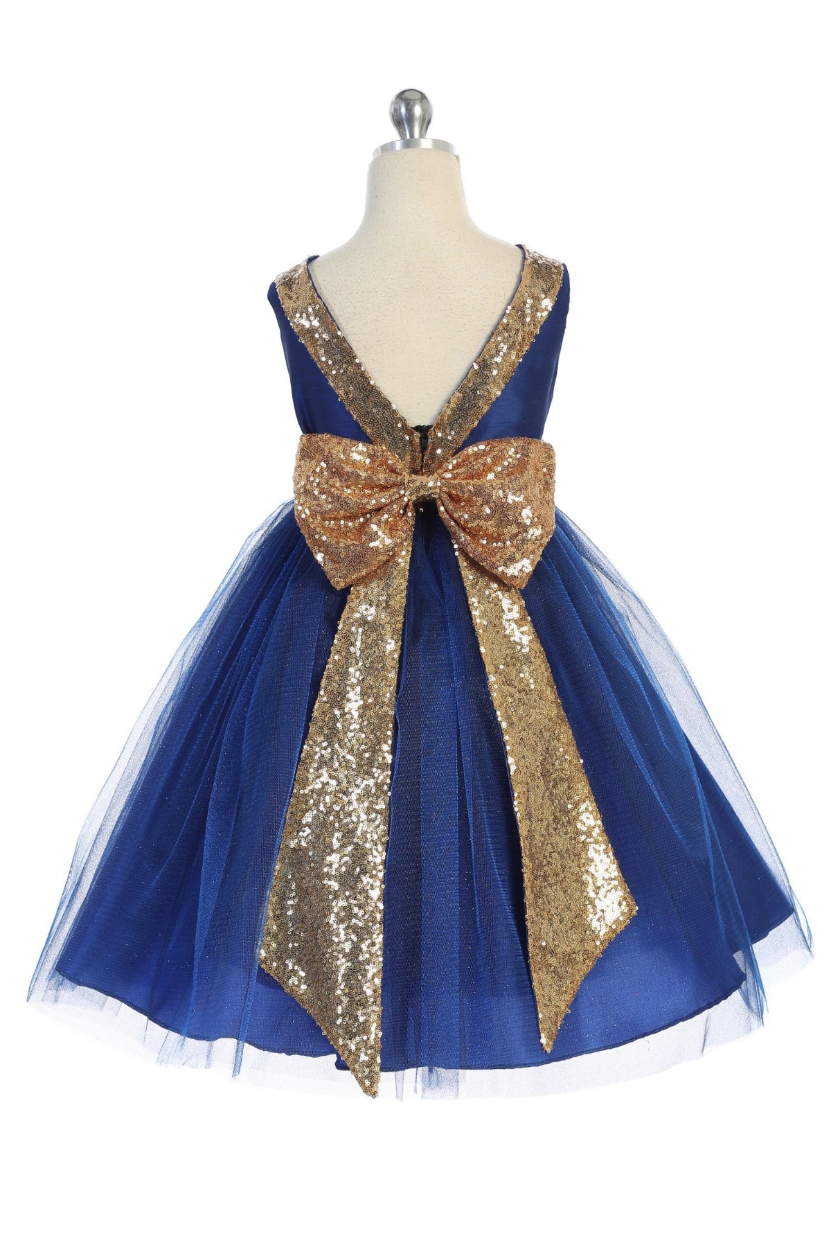 Back view of girls' royal blue dress showing dramatic V-back with gold sequin bow and glitter tulle skirt