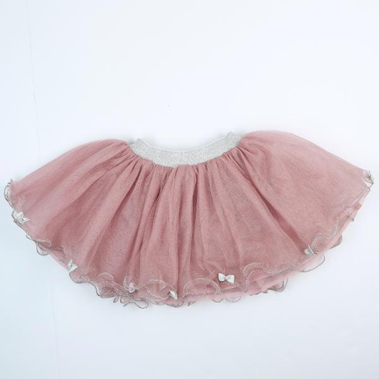 A pink tulle tutu with silver bows on a white background.