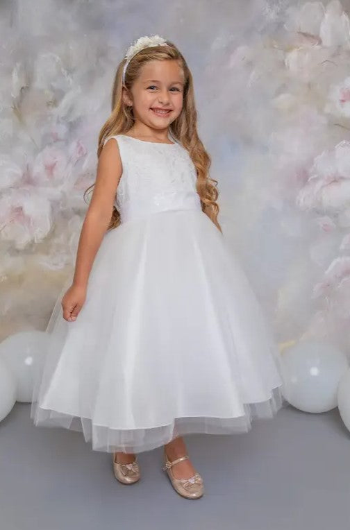 Girl wearing off-white embroidered tulle dress with bow back and layered skirt - front view