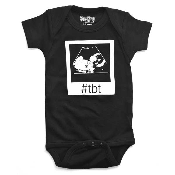 Close-up of black baby onesie showing sonogram print and #TBT throwback design for 12-18 months