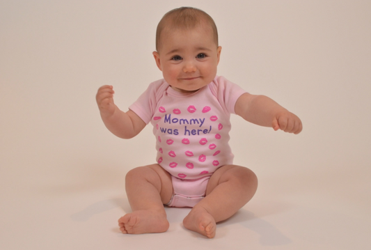 Pink baby onesie with pink kisses from mommy print and mommy was here text for 12-18 months