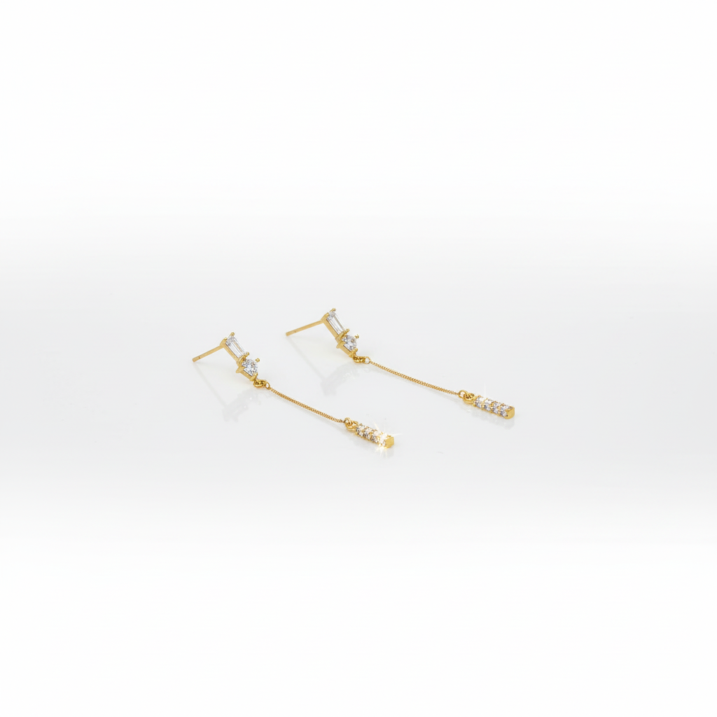 Hero image of gold-tone CZ bar drop earrings on white