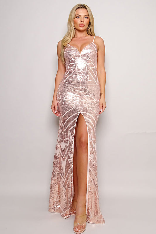 A female model wearing a rose gold sequin gown with a sleeveless design and a V-neckline. The gown features a geometric pattern and a thigh-high slit in the middle