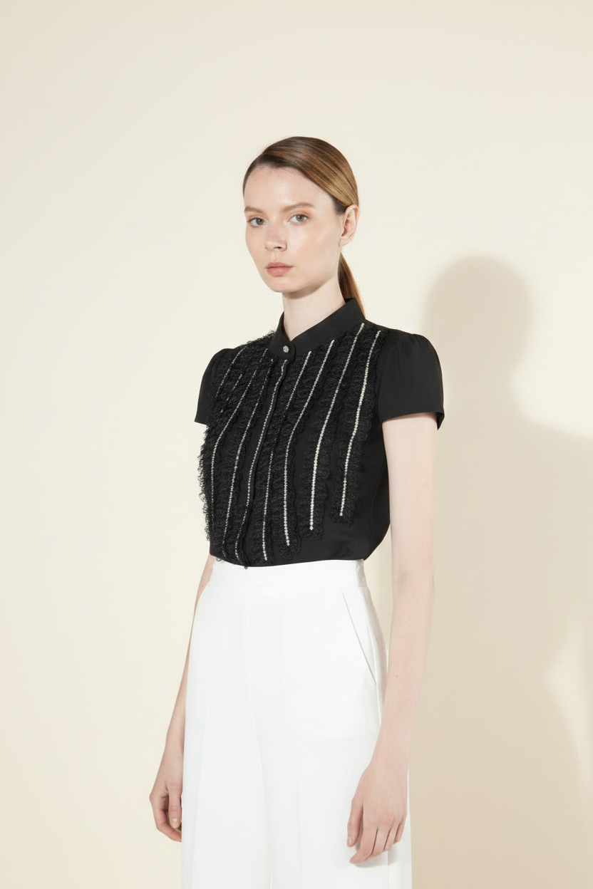 Black boucle fringe crop top 3/4 view showing fitted silhouette and sequin detail