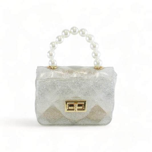 A white quilted mini jelly purse with a pearl-like beaded handle and a gold-tone lock closure.