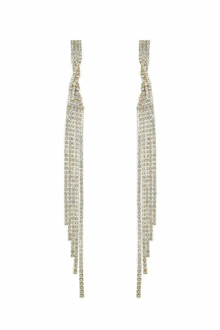 This image displays a pair of elegant twisted drop earrings, characterized by five distinct rows of sparkling stones. Each earring hangs gracefully, with the shimmering stones catching the light, emphasizing their brilliance and adding a touch of sophistication to the wearer's ensemble.