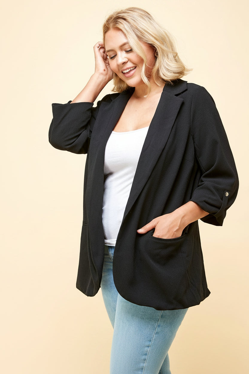 Plus size black blazer angled front view – notched lapel and ruched sleeve detail on open-front curvy women's blazer