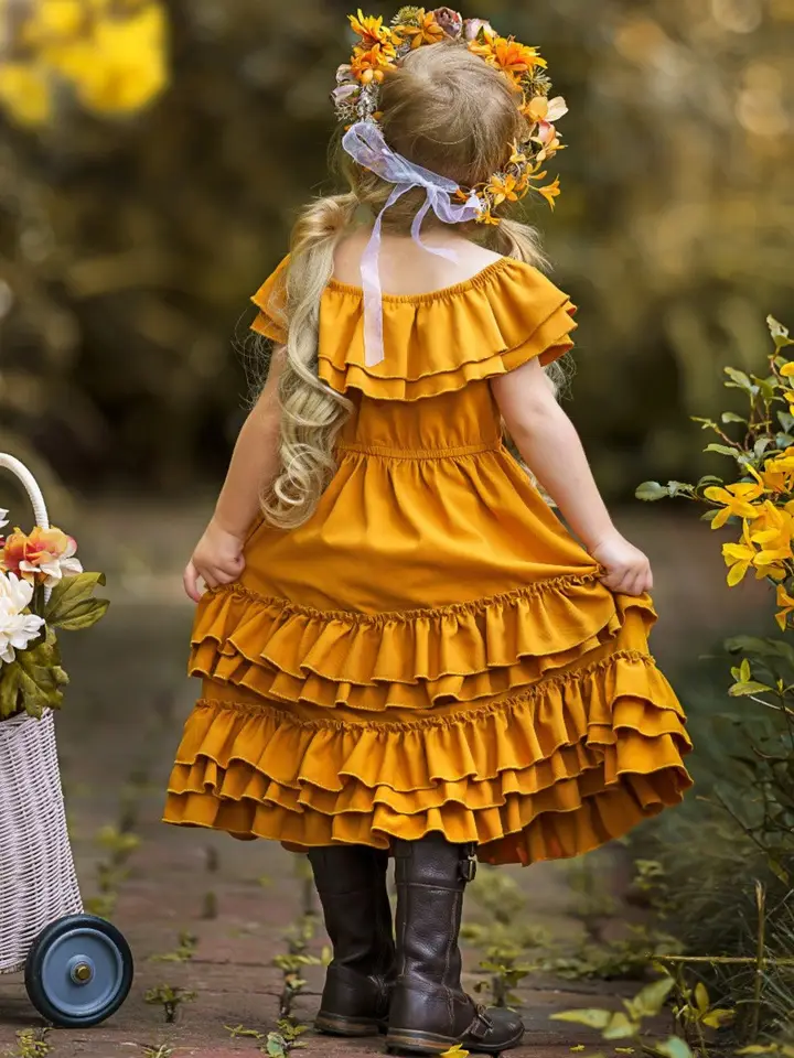 Back view of girl wearing marigold yellow off-shoulder tiered ruffle midi dress