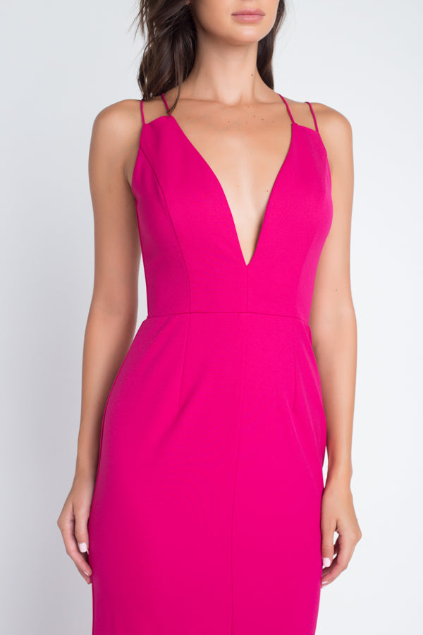 Close-up of hot pink formal dress showing plunging V-neckline and spaghetti strap construction