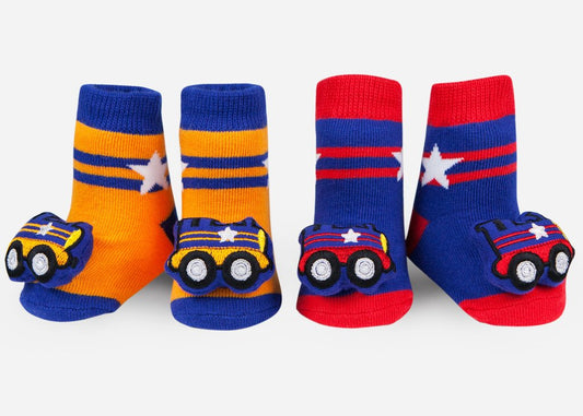 two pairs of baby rattle socks with colorful train designs on them, displayed in two different angles showing the top and side.