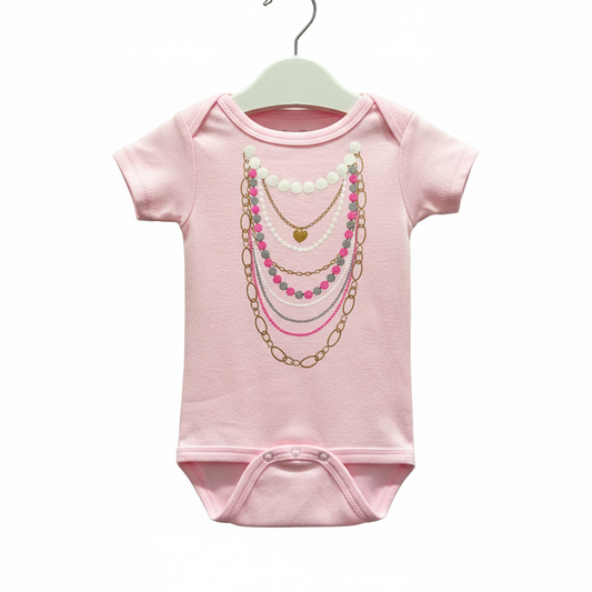 Pink necklace onesie on hanger clean background