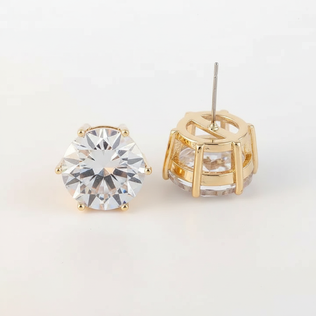 Round crystal CZ stud earrings in gold showing prong setting and post back detail