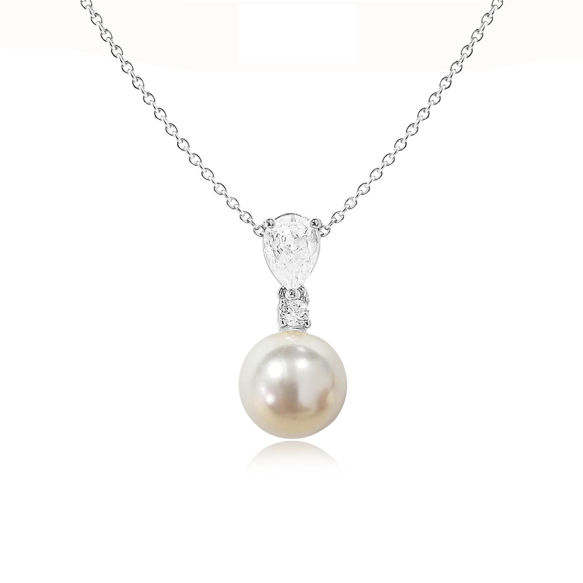 Pearl pendant necklace with cubic zirconia accents on silver chain against white background
