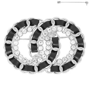 Silver and black interlocking circle statement brooch with pavé rhinestones