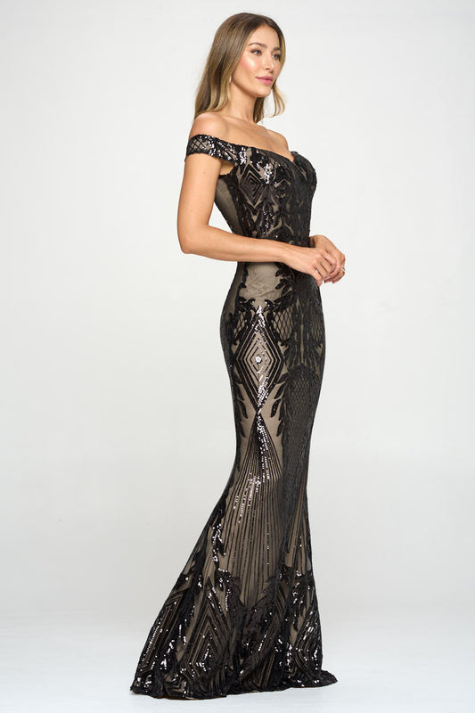 A side profile of a woman wearing an off-shoulder, black and nude mermaid dress with a train.