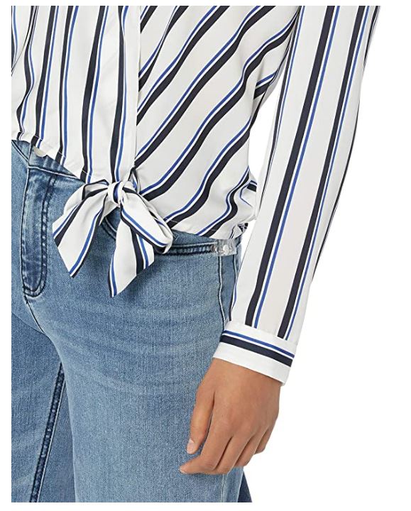 Close-up of side tie detail on striped wrap blouse paired with denim jeans