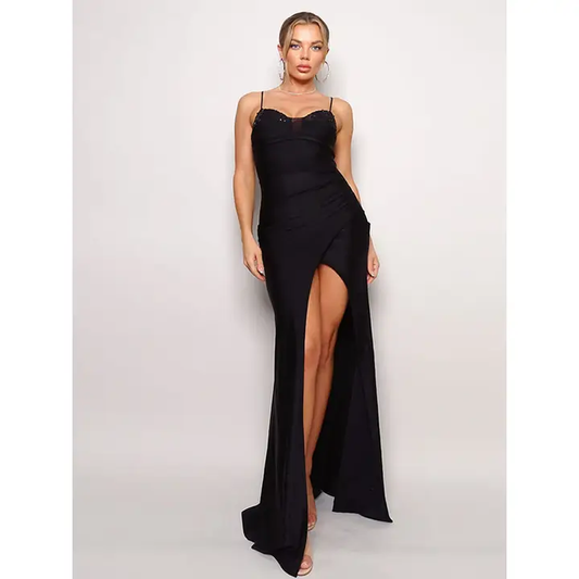 This image features a sophisticated and elegant Sequin Bust Maxi Gown. The gown is designed with a sleek, black fabric and showcases a plunging neckline with a delicate bow detail at the chest.
