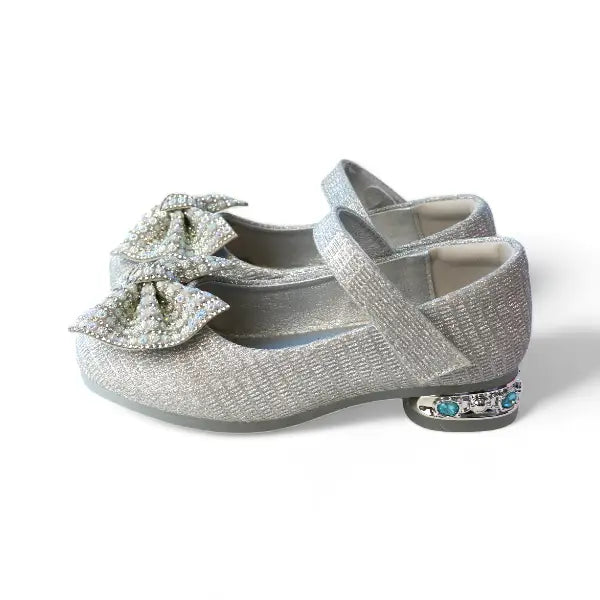 Girls silver glitter Mary Jane dress shoes with rhinestone bow embellishment and jeweled heel detail