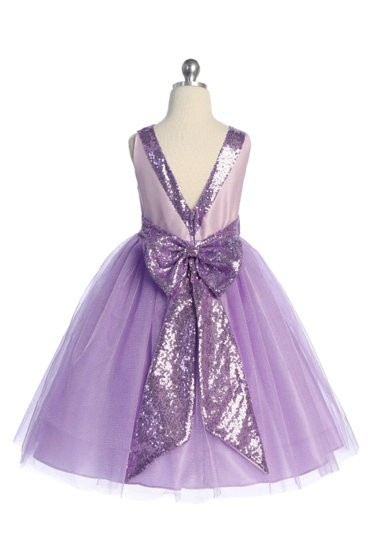 Back view of girls' lavender dress showing V-back with oversized purple sequin bow and layered tulle skirt, flower girl party dress