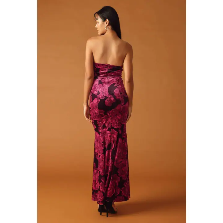 Back view of strapless burgundy velvet maxi dress showing full-length silhouette