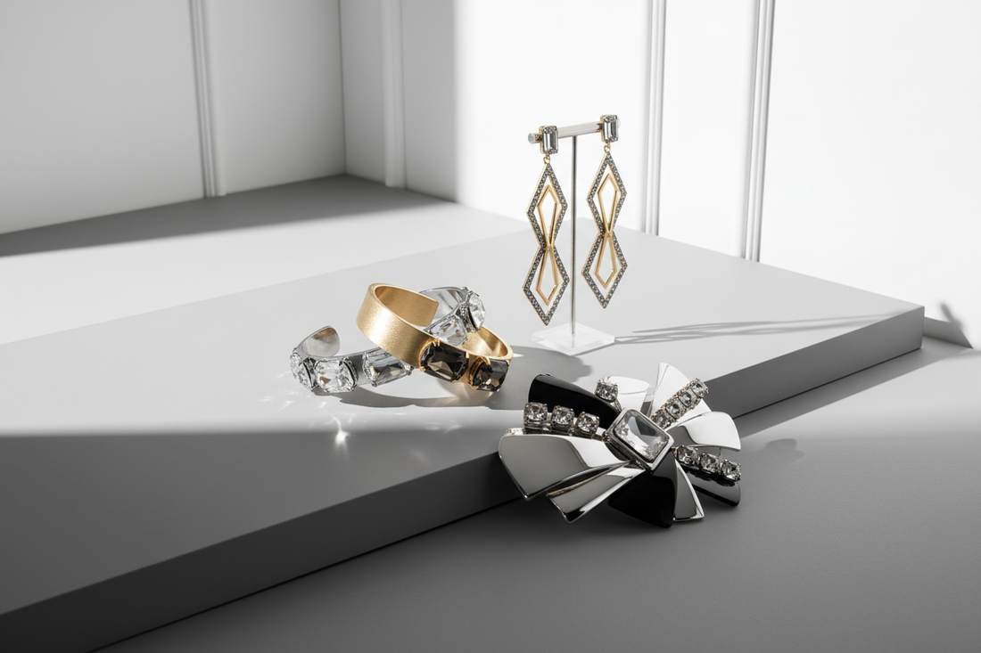 Statement rhinestone jewelry pieces styled against a clean white background for minimalist fashion editorial