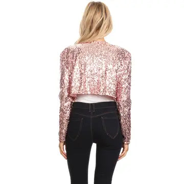 Back view of woman wearing rose gold sequin bolero jacket showing complete sequin coverage and tailored fit
