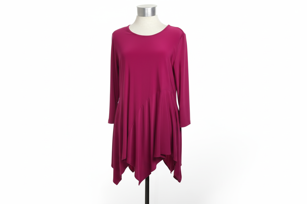 Back view of vibrant magenta asymmetric tunic on elevated dress form with white marble floor, bright studio lighting, luxury boutique presentation