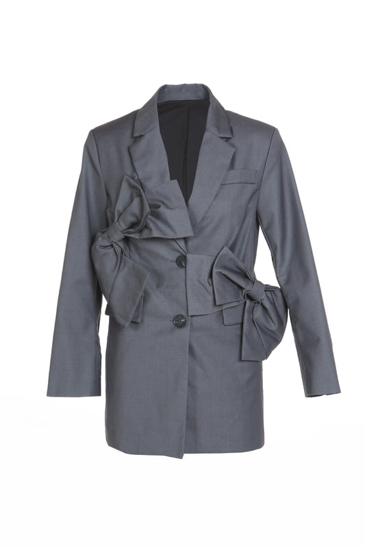 Front view of charcoal grey sculptural bow blazer with notched lapel and two-button closure – women's couture-inspired blazer