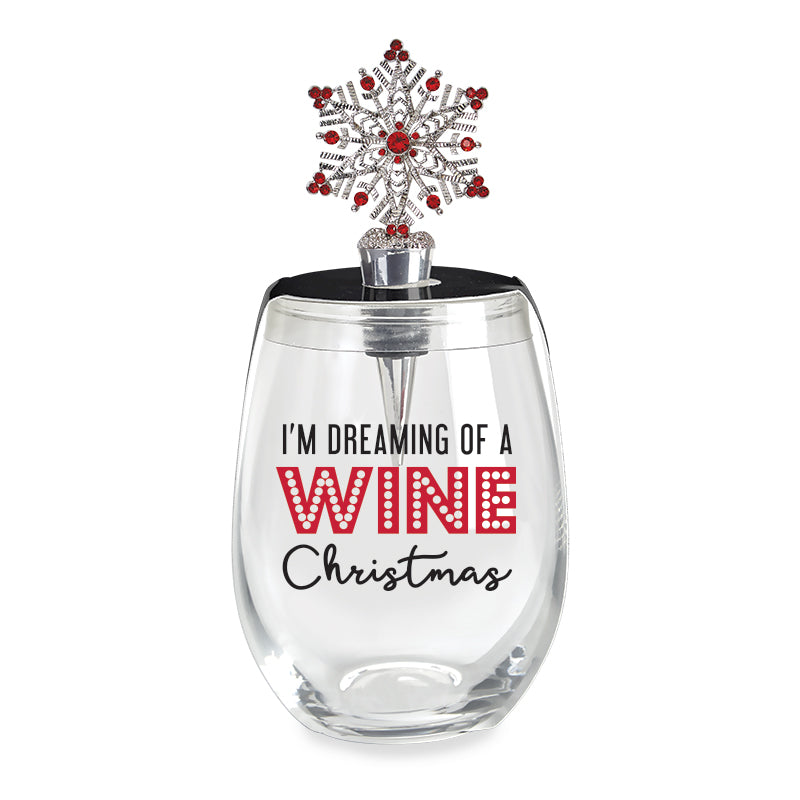 Clear wine glass with 'I'm Dreaming of a Wine Christmas' text and snowflake stopper on a white background