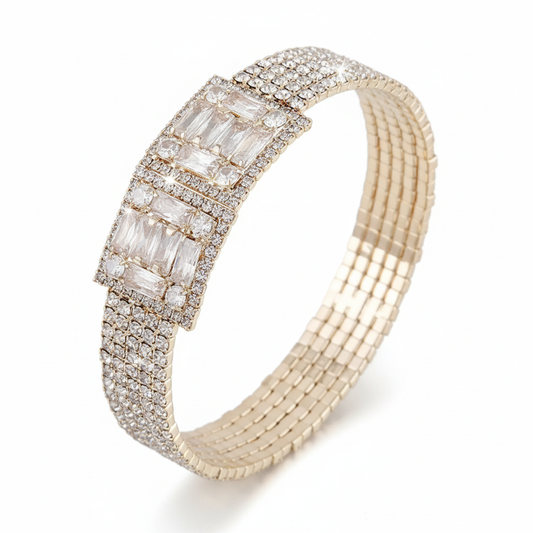 Gold crystal block bracelet with rectangular rhinestone centerpiece, angled view, bright white background, professional studio lighting