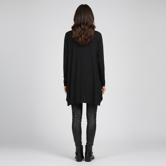 Back view of woman wearing Black and Rose Statement Pocket Tunic with leather leggings and boots
