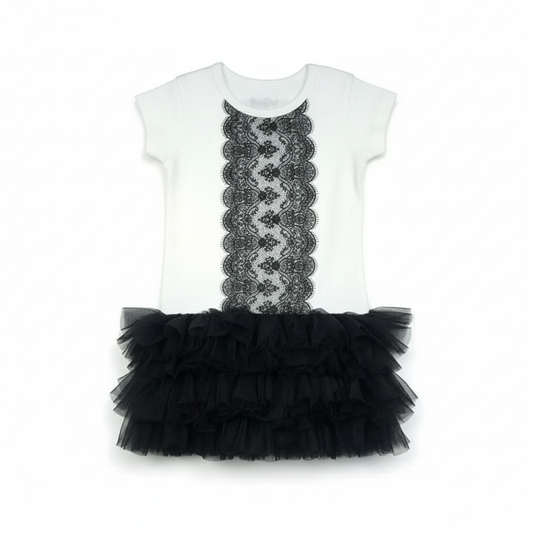 White baby onesie with black lace panel and black ruffled tulle skirt on white background with professional studio lighting
